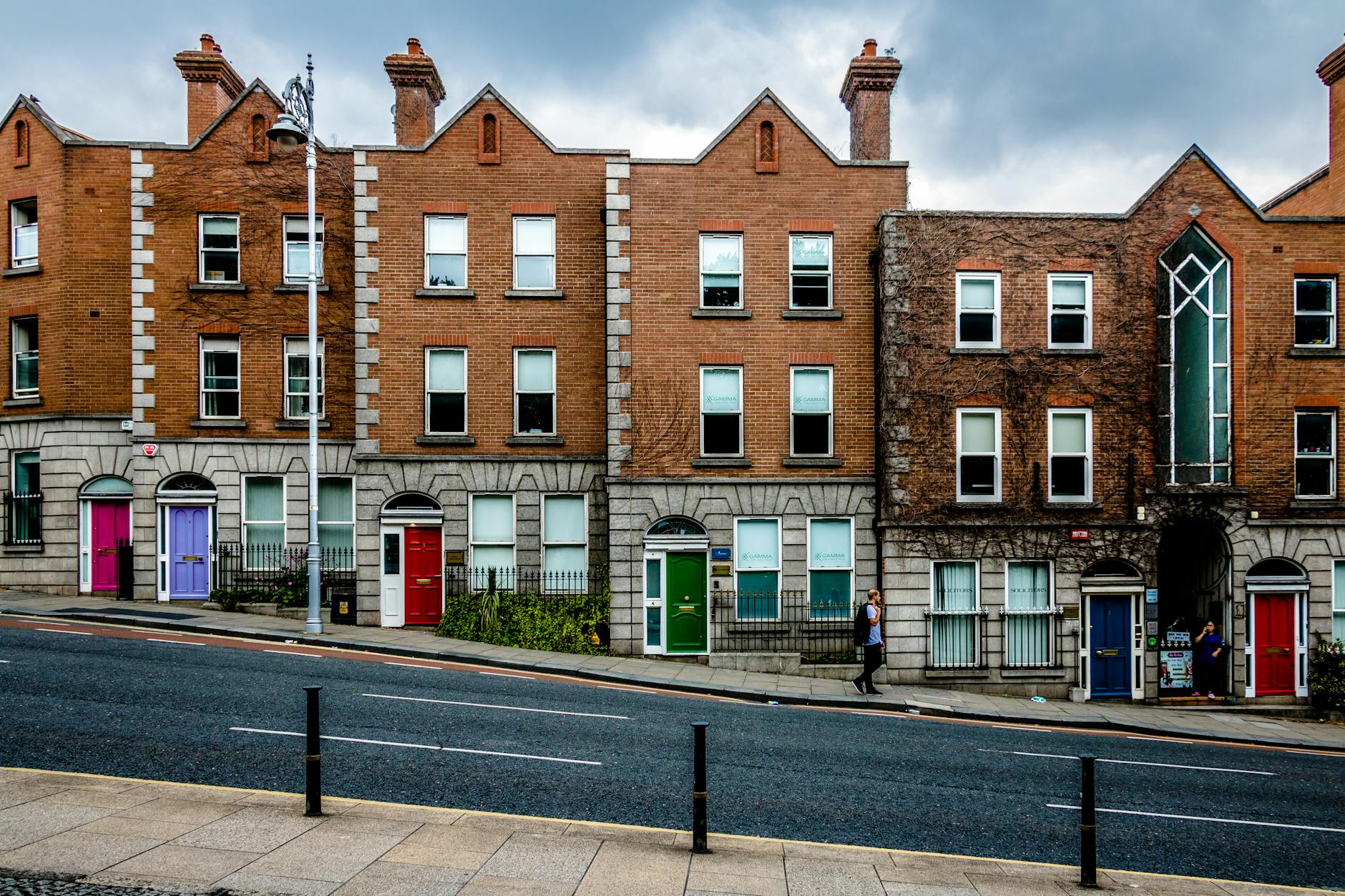 brown buildings beside road